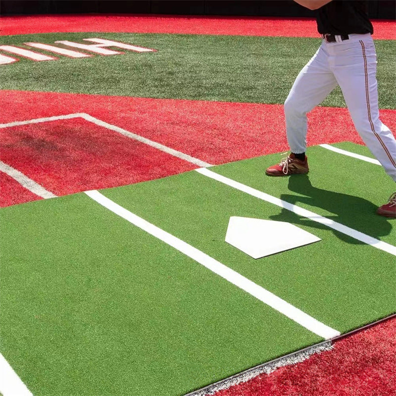 The player is standing on the Baseball pitcher's mats
